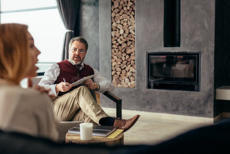 Family psychologist consulting couple in trouble. stock photo Family psychologist consulting couple in trouble. stock photo
