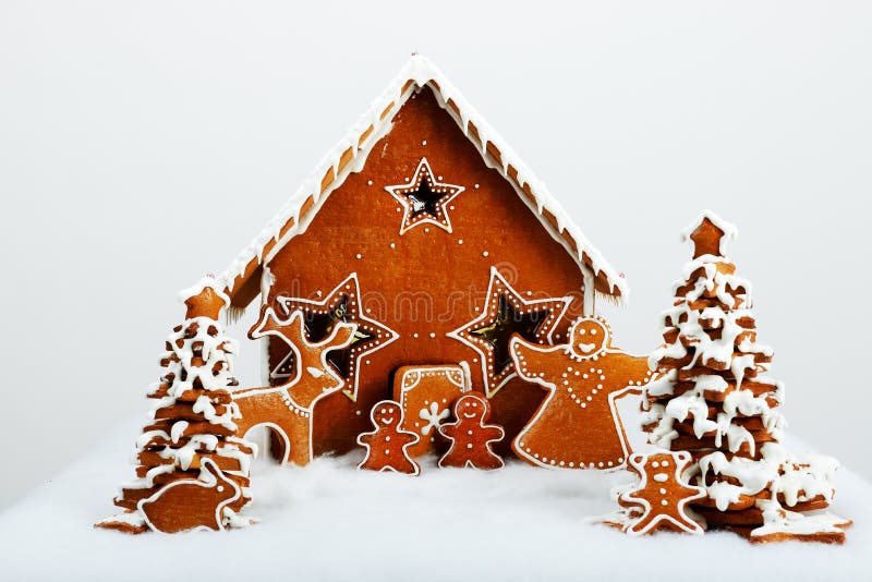 The family and reindeer are near hand-made eatable gingerbread royalty free stock photo The family and reindeer are near hand-made eatable gingerbread royalty free stock photo