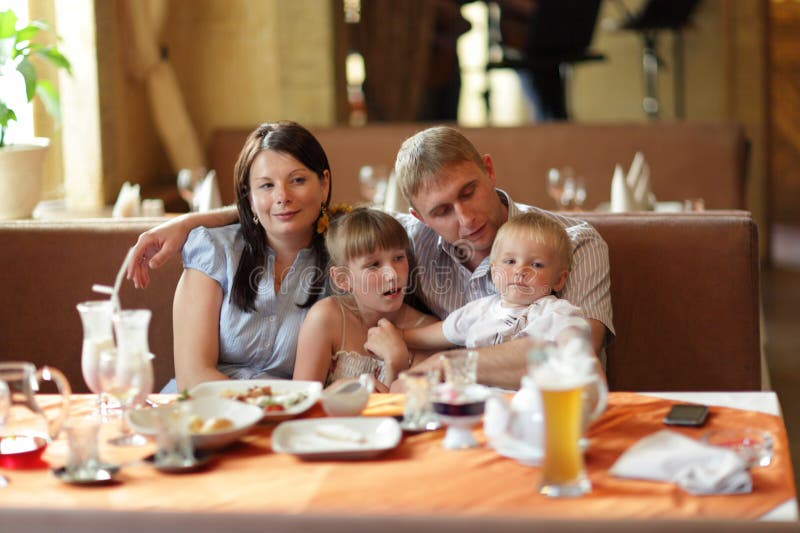 Family at restaurant stock image. Image of indoors, dining - 19992859