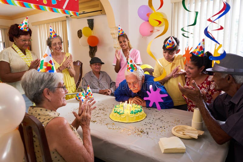 Family Reunion For Birthday Party Celebration In Retirement Home