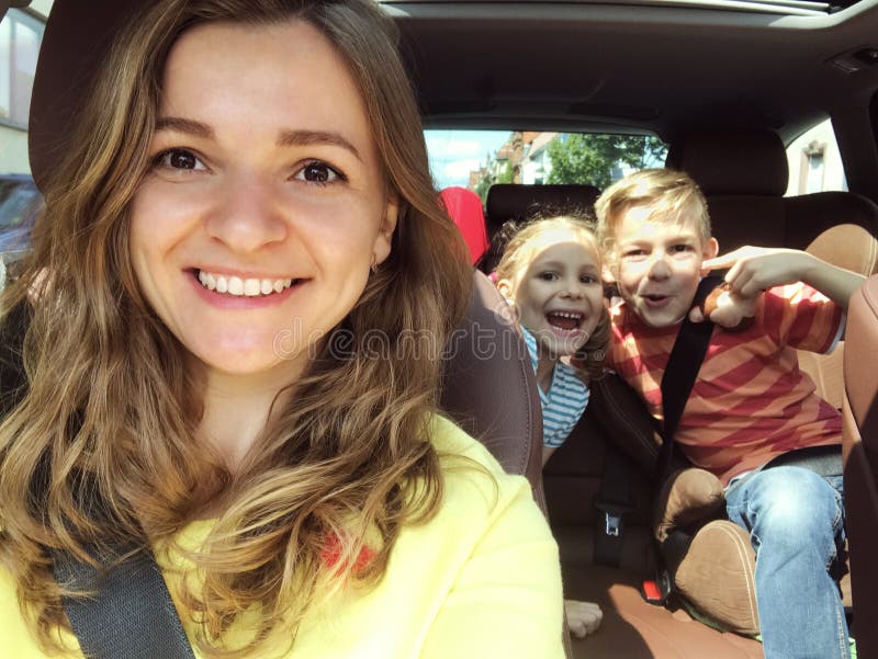 Family selfie photo in car on summer vacation stock photo Family selfie photo in car on summer vacation stock photo