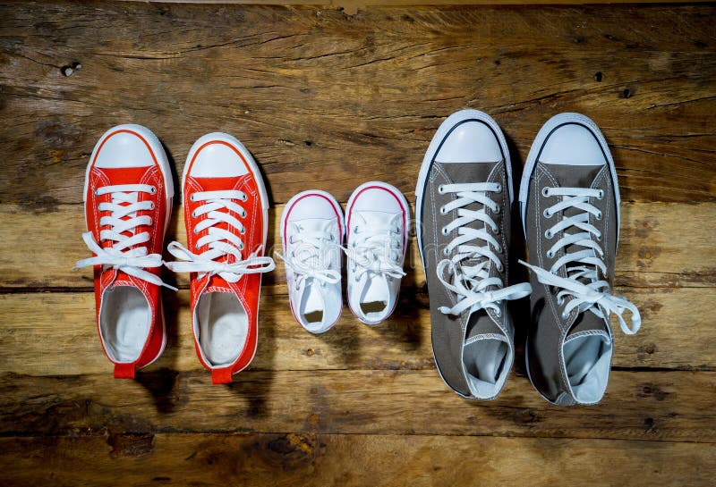 Family Sneakers canvas shoes parents and child on wood floor at home in happy lifestyle royalty free stock image Family Sneakers canvas shoes parents and child on wood floor at home in happy lifestyle royalty free stock image