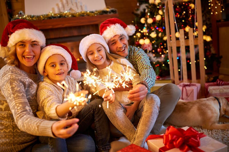 Family with Sparklers Celebrating Christmas Stock Photo - Image of ...