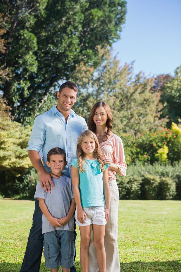 Family standing in the countryside