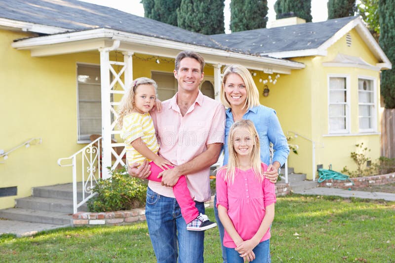 Family Standing Outside Suburban Home stock images Family Standing Outside Suburban Home stock images