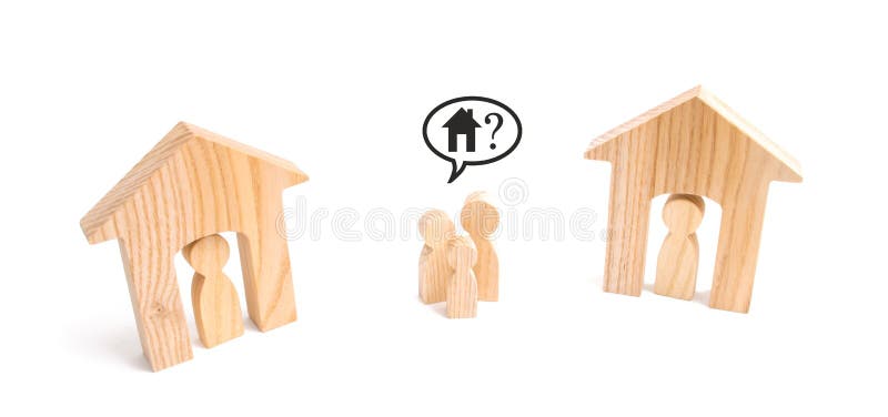 A family stands between two inhabited houses. The concept of lack of housing. Expensive housing and loans. Homeless family. stock images A family stands between two inhabited houses. The concept of lack of housing. Expensive housing and loans. Homeless family. stock images