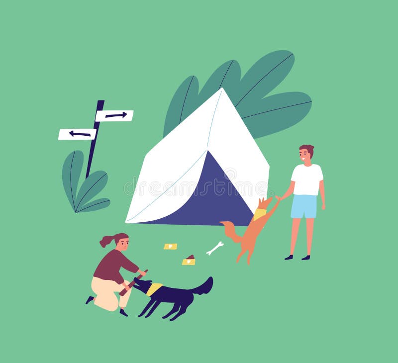 Family on summer outdoor camping vacation. Young couple playing with dogs near a tent. Man and woman relaxing on