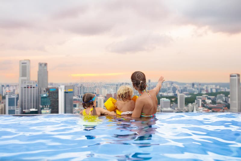 Kids swim in Singapore roof top swimming pool