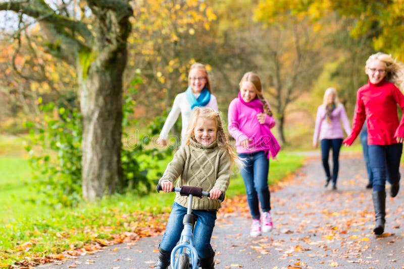 Family taking walk in autumn fall forest royalty free stock photo Family taking walk in autumn fall forest royalty free stock photo