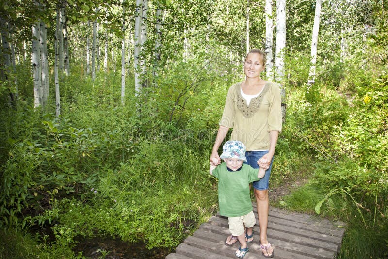 Family taking a walk in the woods together stock image Family taking a walk in the woods together stock image