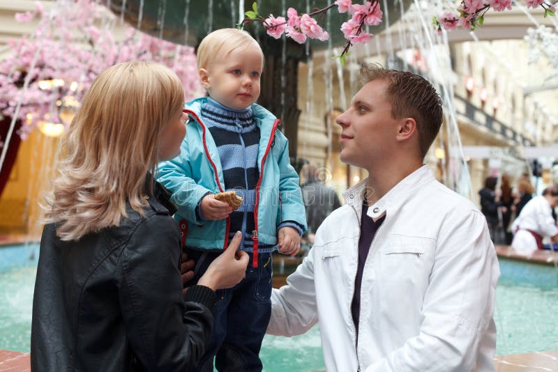 Family of three people on walk. stock images