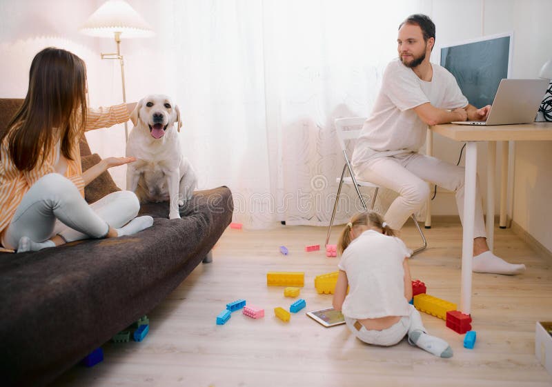 Rest time of caucasian family in living room at home