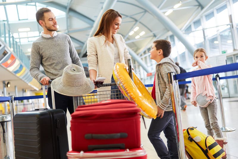 Family and two kids in the airport terminal