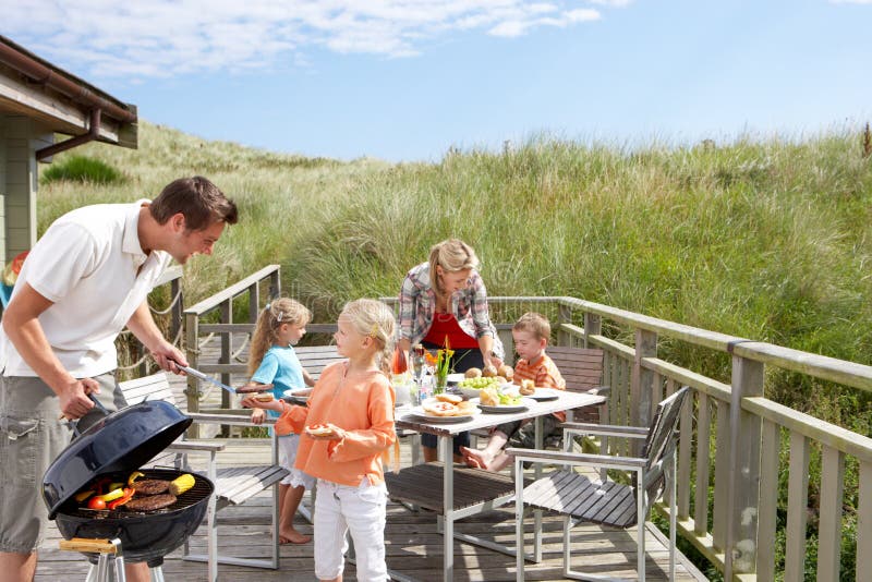 Family on vacation having barbecue