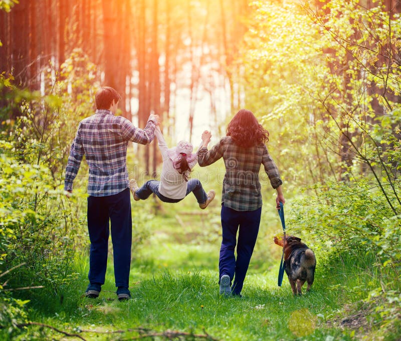 Family walking in the forest