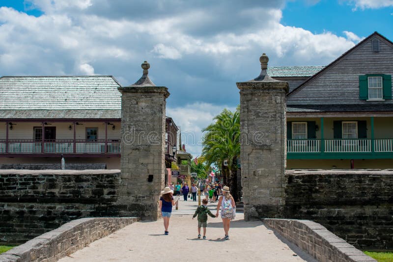 Family walking in Old City Gate at on St. George street in Florida`s Historic Coast 3 stock photo Family walking in Old City Gate at on St. George street in Florida`s Historic Coast 3 stock photo