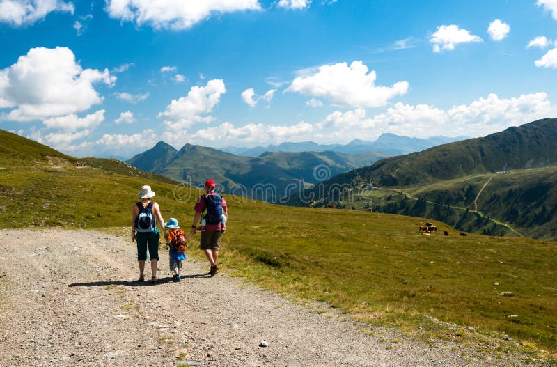 Family walking together in the mountain scenery stock images Family walking together in the mountain scenery stock images