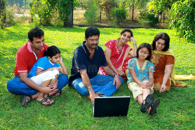 Family watching the laptop.