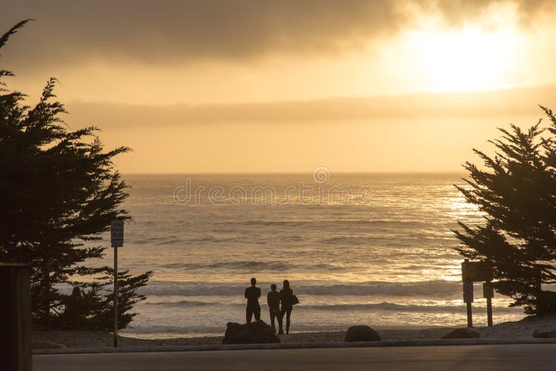 Family Watching the Sunset in Carmel, California Stock Photo Image of