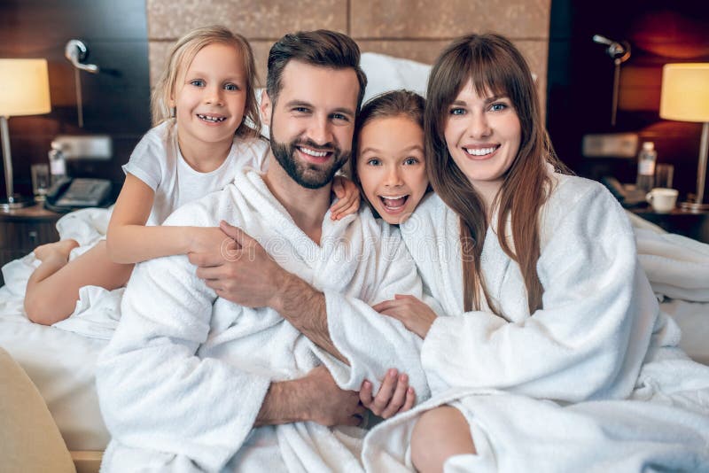 Family in White Robes Smiling and Looking Wonderful Stock Image Image