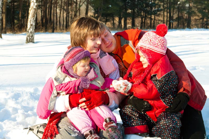 Family in winter park stock image