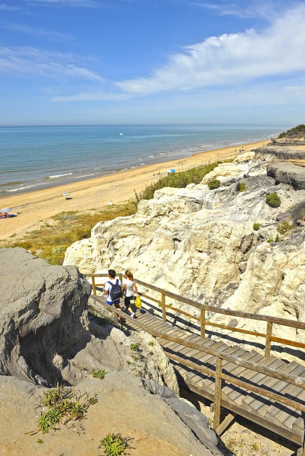 Wooden staircase at the Cliff of Asperillo in Mazagon beach in province of Huelva, Andalusia, Spain. Famous beach located on the Coast of Light Costa de la Luz royalty free stock image Wooden staircase at the Cliff of Asperillo in Mazagon beach in province of Huelva, Andalusia, Spain. Famous beach located on the Coast of Light Costa de la Luz royalty free stock image