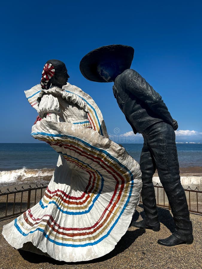 Vallarta Dancers is a sculpture by Jim Demetro, installed along Puerto Vallarta`s Malecón, in the Mexican state of Jalisco. This famous sculpture on a scenic ocean boardwalk El Malecon, was gifted to the city by the artist and is a popular tourist destination in the seaside Mexico city of Puerto Vallarta. Vallarta Dancers is a sculpture by Jim Demetro, installed along Puerto Vallarta`s Malecón, in the Mexican state of Jalisco. This famous sculpture on a scenic ocean boardwalk El Malecon, was gifted to the city by the artist and is a popular tourist destination in the seaside Mexico city of Puerto Vallarta.