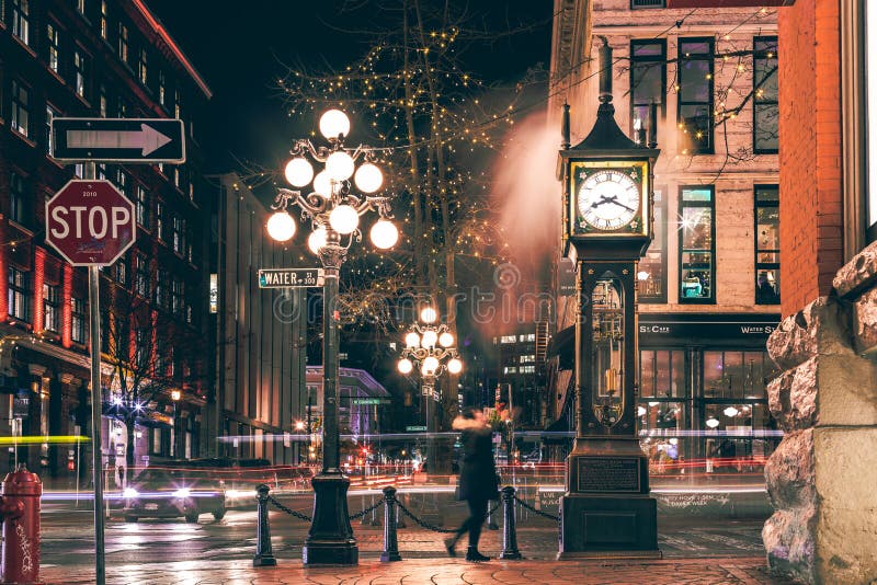 The famous Steam Clock in Gastown in Vancouver city with cars light trails at night royalty free stock image The famous Steam Clock in Gastown in Vancouver city with cars light trails at night royalty free stock image
