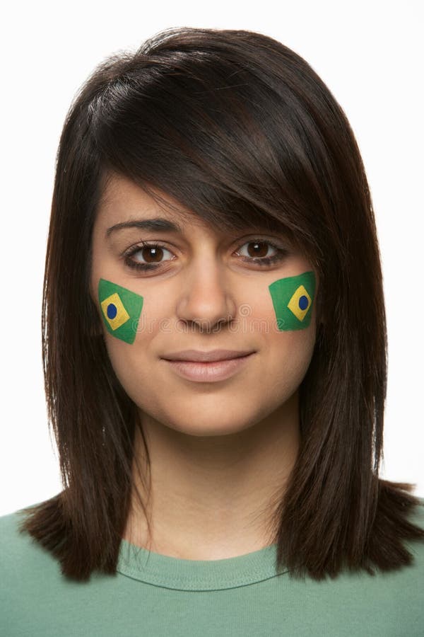 Fan al sportului cu steagul brazilian pictat pe față royalty free stock photos
