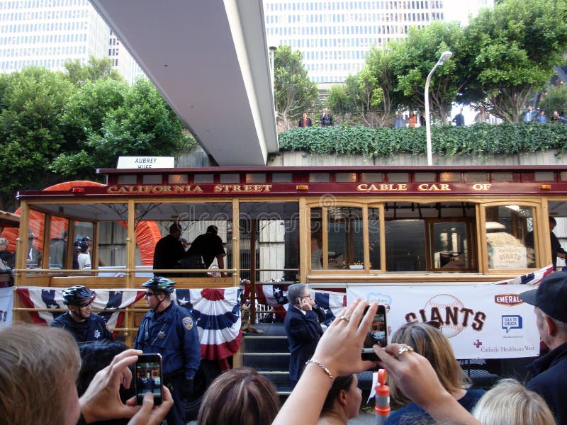 SAN FRANCISCO, CA - NOVEMBER 3: Giants fans take photos with Smart Phones of players on Trolley Car before the start of the 2010 Giants World Championship Parade with fans waving and taking photos Nov. 3, 2010 San Francisco, CA. SAN FRANCISCO, CA - NOVEMBER 3: Giants fans take photos with Smart Phones of players on Trolley Car before the start of the 2010 Giants World Championship Parade with fans waving and taking photos Nov. 3, 2010 San Francisco, CA.