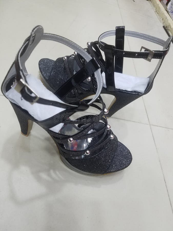 Fancy English heels shoes for ladies stock photos