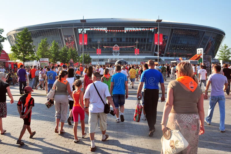 Fans go to the stadium. editorial stock photo. Image of preparation