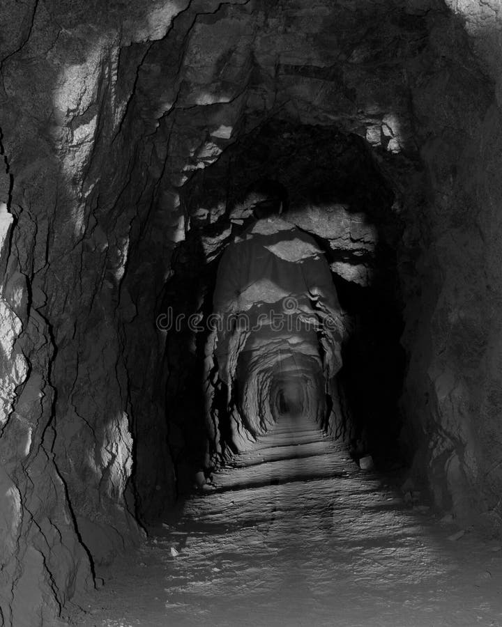 Ghostly figure explores this old mining tunnel. Ghostly figure explores this old mining tunnel.