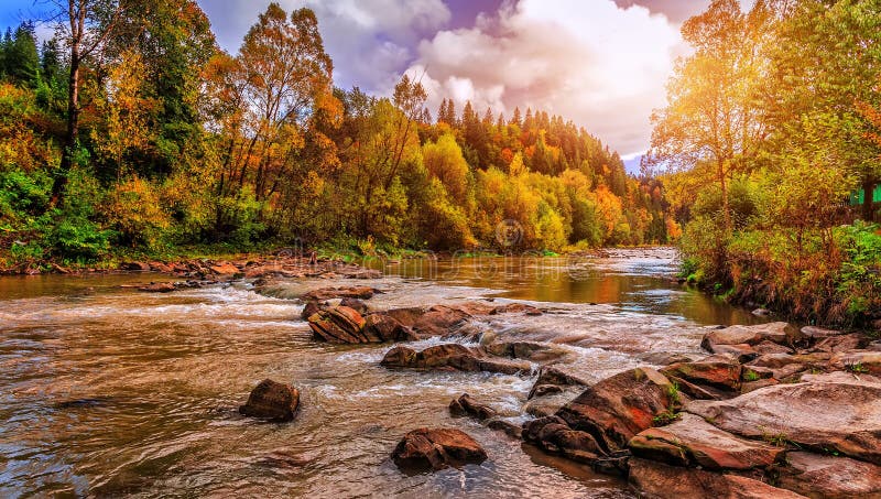 Fantastic colorful view on the mountain river. overcast clouds