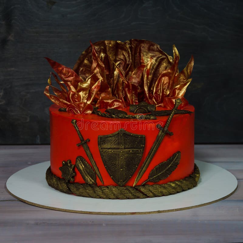 Fantastic red game of thrones cake with gilded decoration