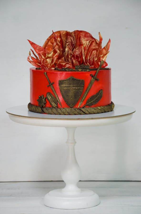 Fantastic red game of thrones cake with gilded decoration