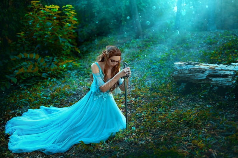 Fantasy elf woman princess warrior sits in forest on green grass holding weapon medieval sword in hands. Warlike queen