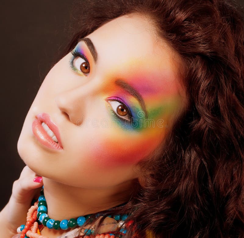 Fantasy. Multicolored Woman's Face. Vibrant Colorful Rainbow Makeup stock photos