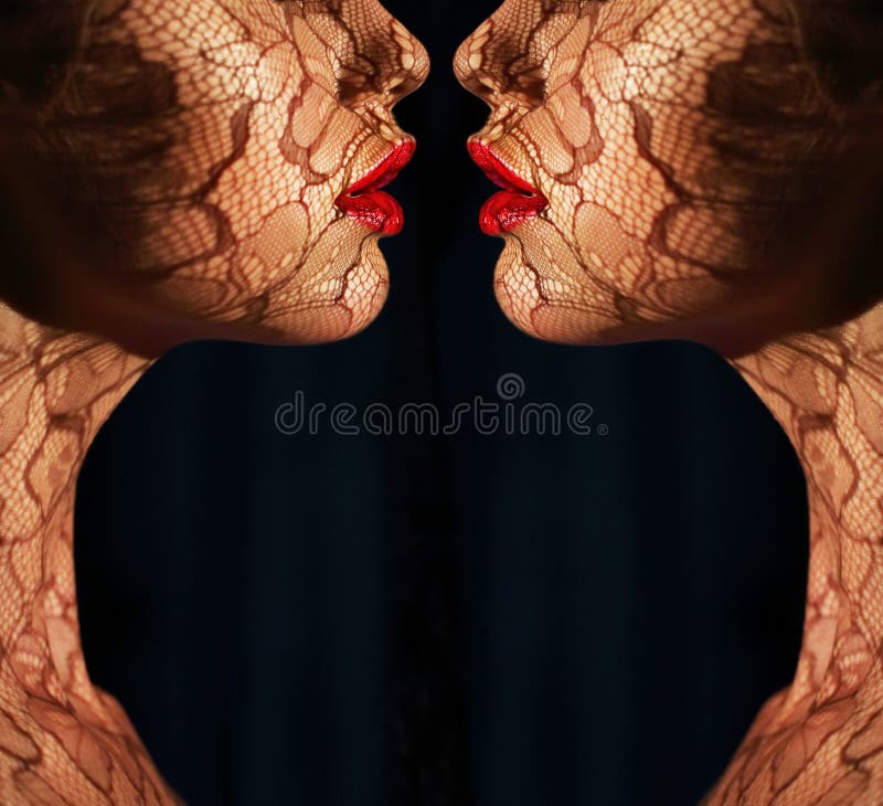 Fantasy. Two Women s Faces with Tracery Opposite each other. Reflexion