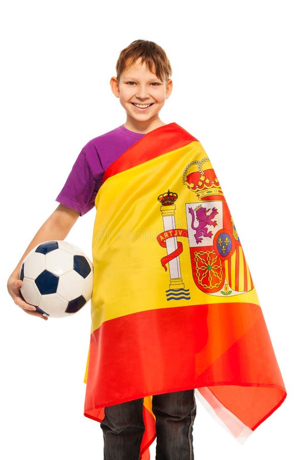Fanático del fútbol sonriente envuelto en bandera española foto de archivo Fanático del fútbol sonriente envuelto en bandera española foto de archivo