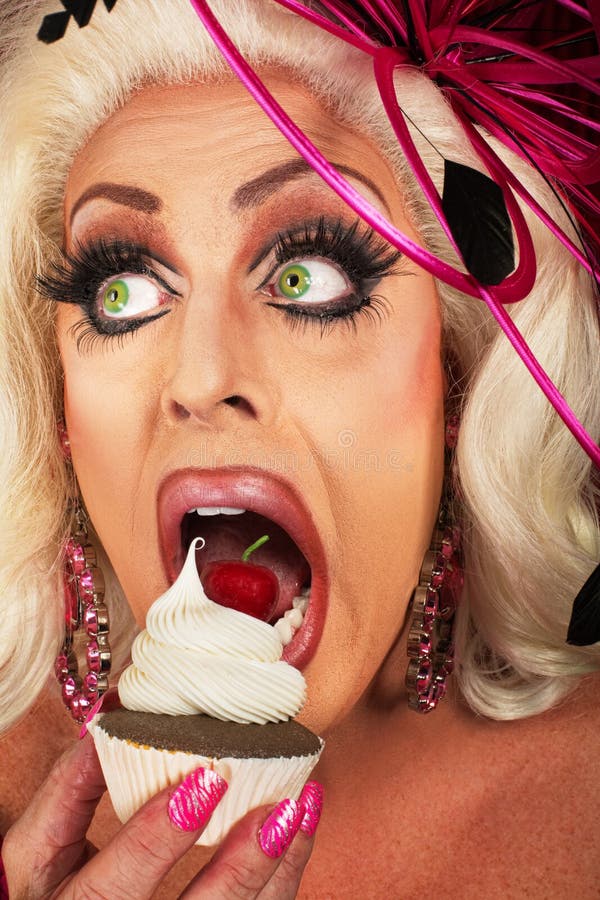 Close up of blond actress eating chocolate cupcake. Close up of blond actress eating chocolate cupcake