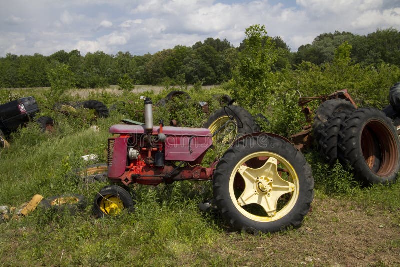 Farm Equipment Junkyard stock image. Image of farmall 73479729