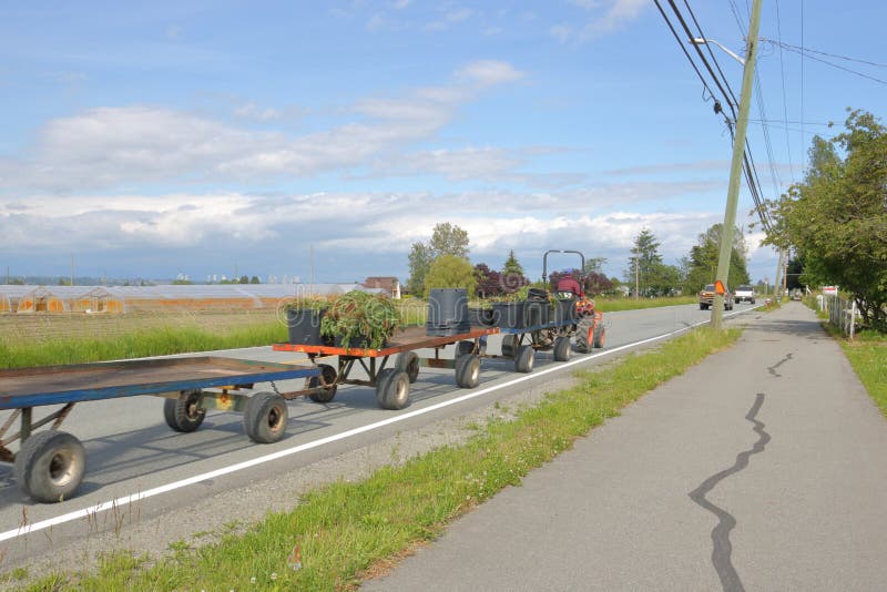 Farm Equipment on Road stock photo. Image of hauling 94465276