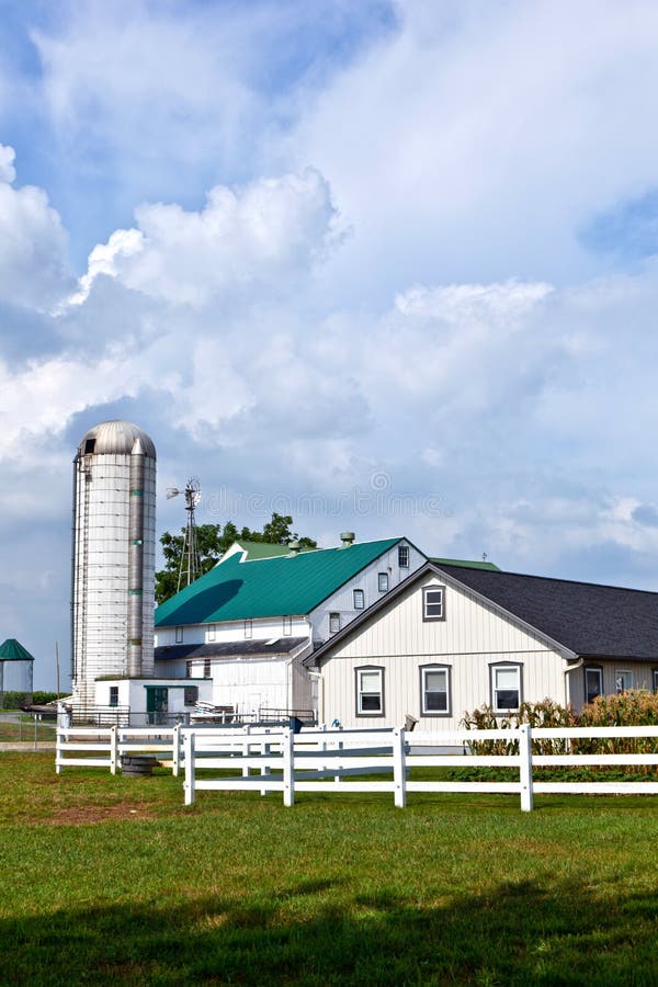 Farm house with field and silo stock image