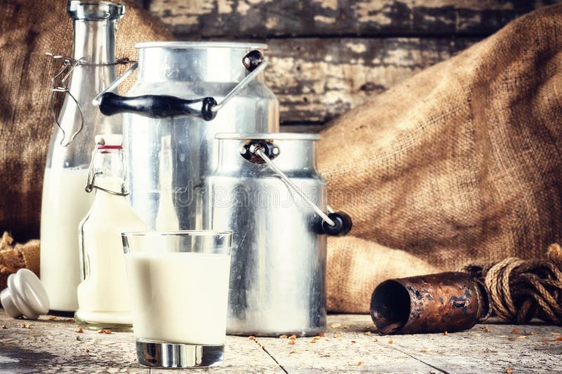 Farm setting with fresh milk in various bottles