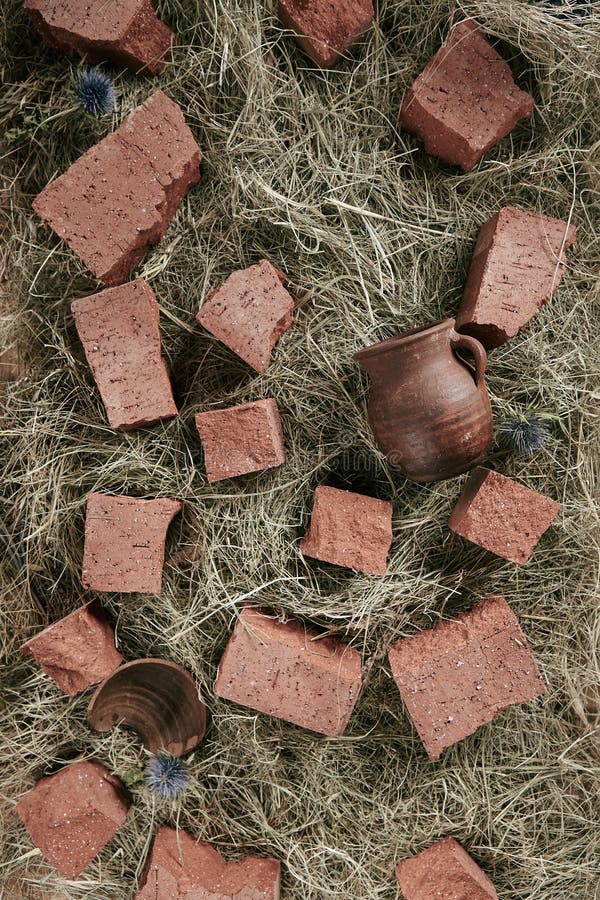 Farm Shed Floor Rustic Background with Straw, Natural Ceramic Pot and Broken Bricks Top View royalty free stock photos Farm Shed Floor Rustic Background with Straw, Natural Ceramic Pot and Broken Bricks Top View royalty free stock photos
