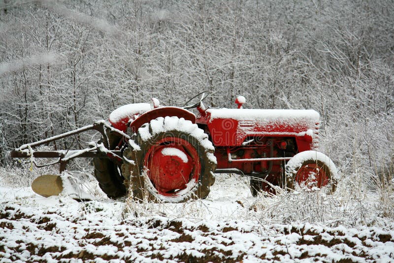 Farm Tractor in Early Snow