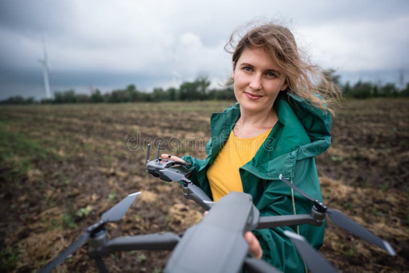 Farmer with drone on a field. stock photography