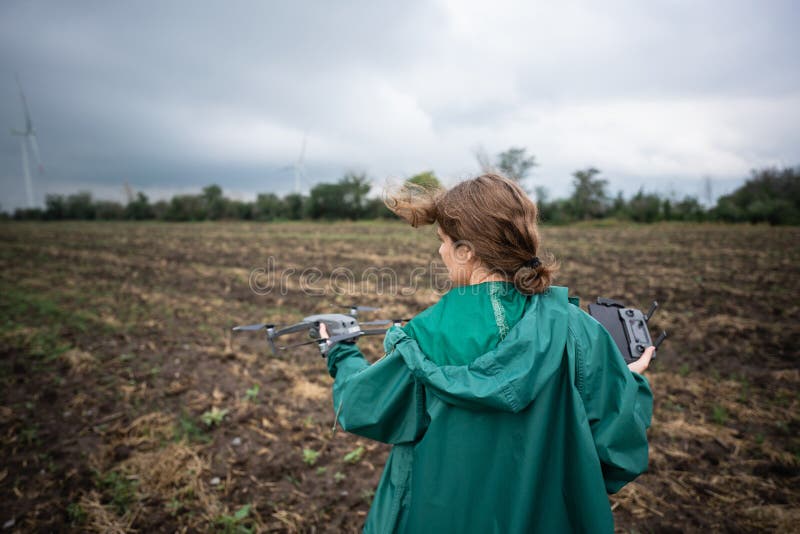 Farmer with drone on a field. stock image