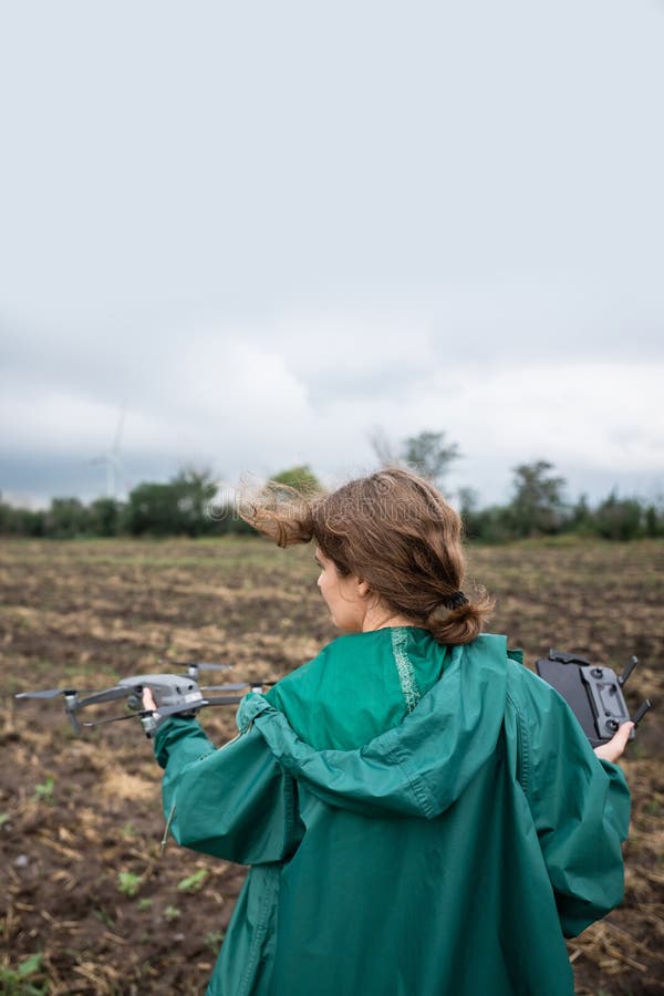 Farmer with drone on a field. stock photo
